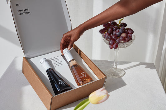 Dry wine: Mixed pack of Usual Wines next to flower and grapes