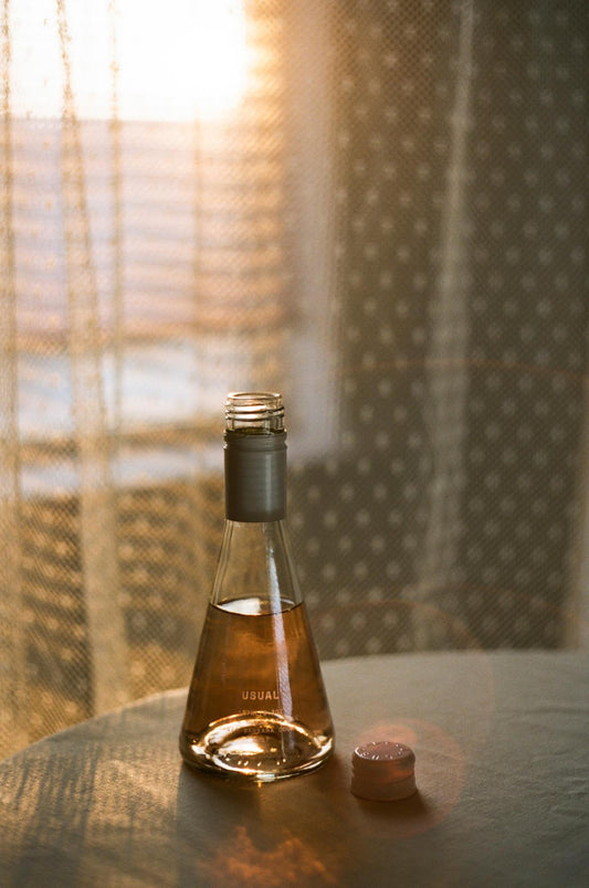 clean crafted wine: Usual Wines bottle on a table