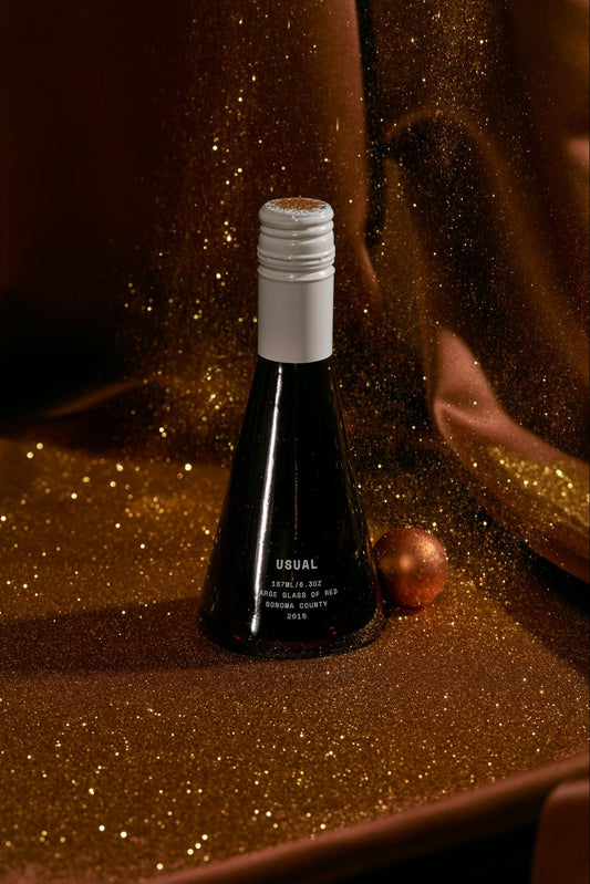 mulled wine: Usual Wines bottle against a glittery backdrop