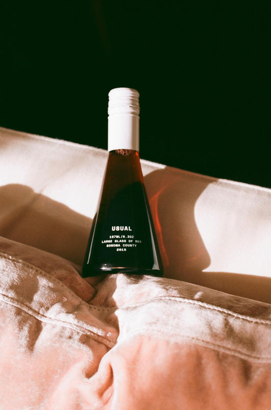 Tempranillo wine: Usual Wine bottle on a pink pillow