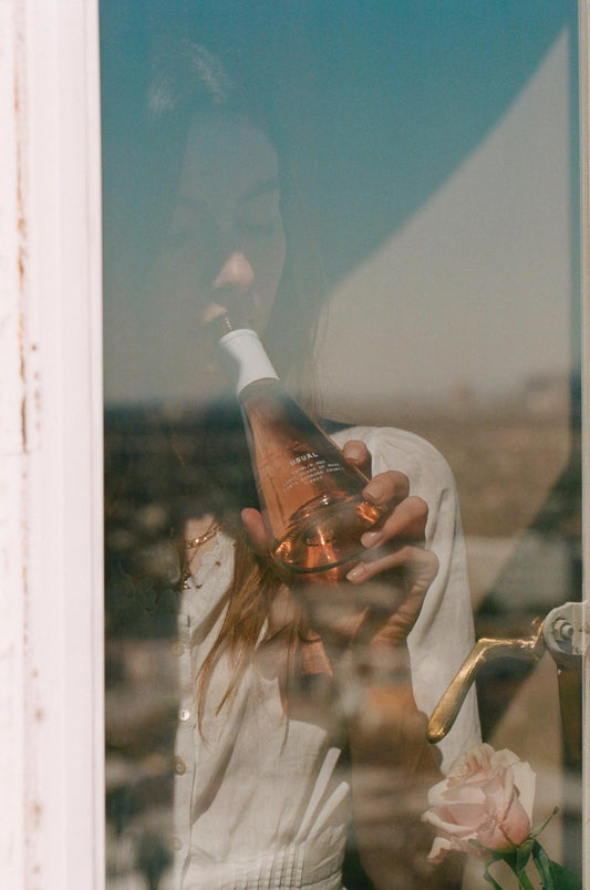 table wine: Girl drinking wine looking out the window