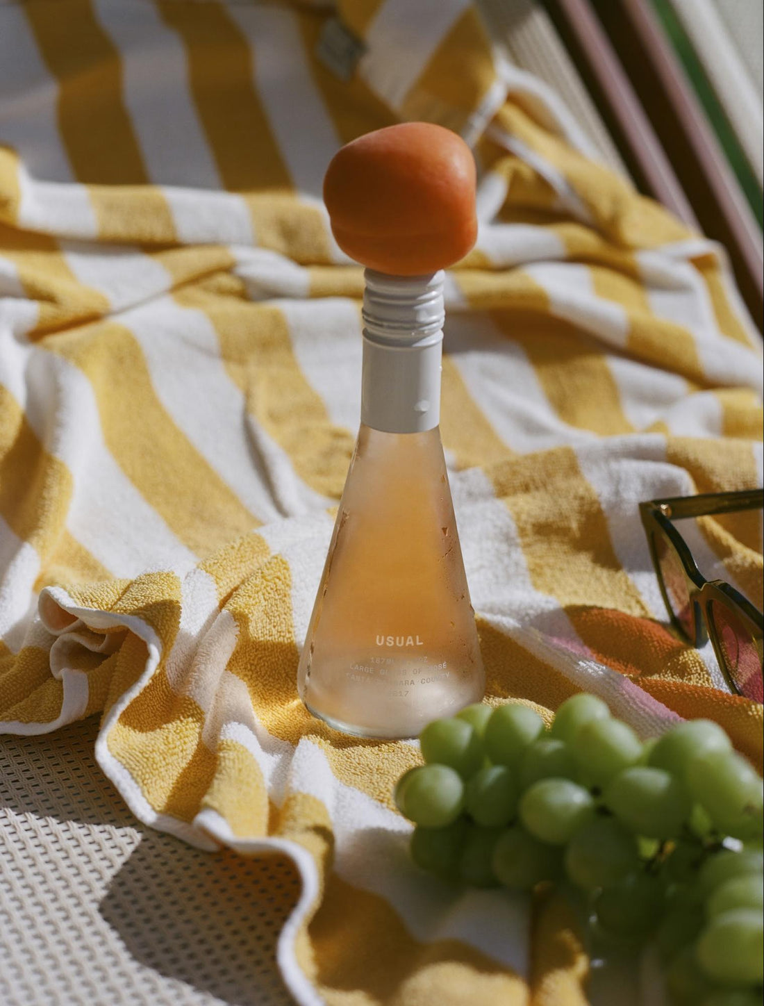 skinny wine: Usual Wines bottle with an orange on top